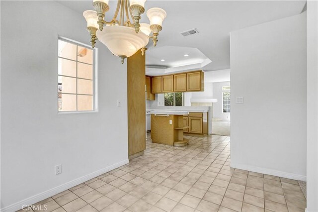 4064 Lemonberry Pl, Thousand Oaks, CA 91362 - kitchen featuring a raised ceiling, light countertops, baseboards, a chandelier, and recessed lighting