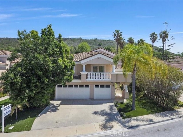 4064 Lemonberry Pl, Thousand Oaks, CA 91362 - mediterranean / spanish house with concrete driveway, a garage, stucco siding, and stairway
