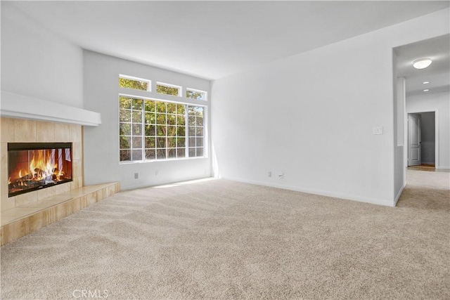 4064 Lemonberry Pl, Thousand Oaks, CA 91362 - unfurnished living room featuring carpet, a tiled fireplace, and baseboards
