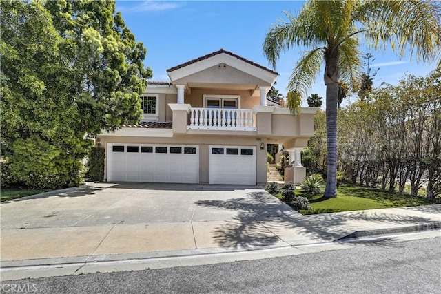 4064 Lemonberry Pl, Thousand Oaks, CA 91362 - view of front of home featuring a balcony, a garage, stucco siding, driveway, and a tiled roof