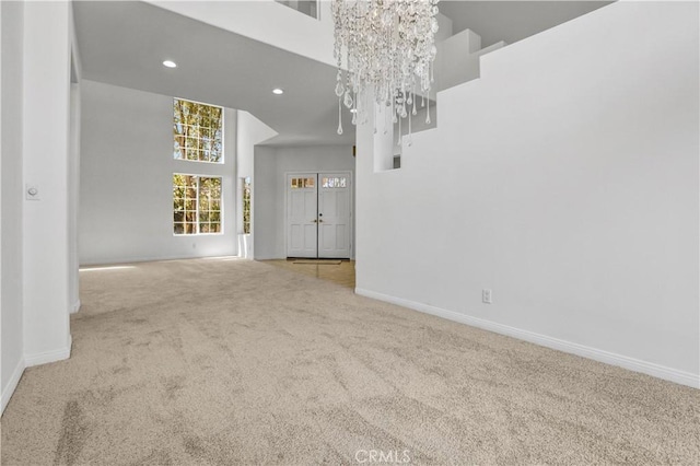 4064 Lemonberry Pl, Thousand Oaks, CA 91362 - unfurnished dining area with carpet flooring, a chandelier, baseboards, a high ceiling, and recessed lighting