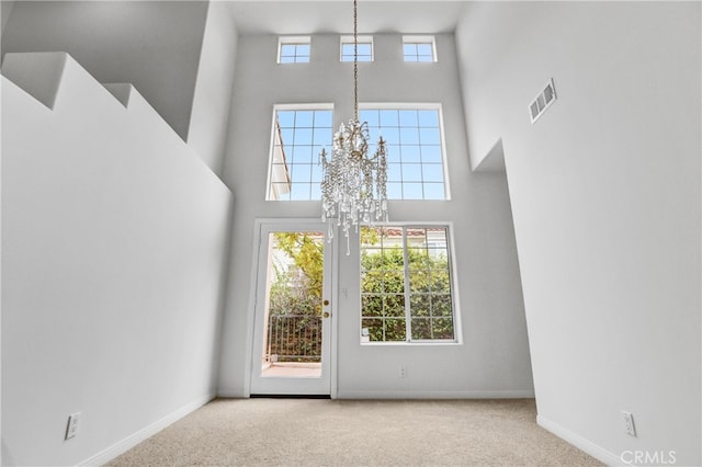 4064 Lemonberry Pl, Thousand Oaks, CA 91362 - foyer with a towering ceiling, carpet flooring, baseboards, and a chandelier