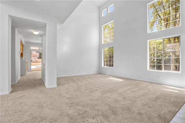 4064 Lemonberry Pl, Thousand Oaks, CA 91362 - carpeted empty room with a high ceiling and baseboards