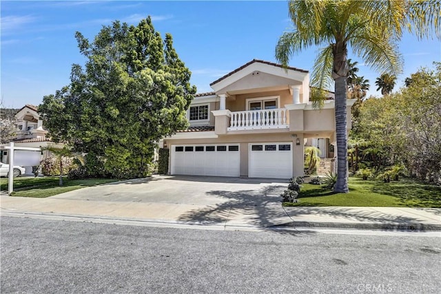 4064 Lemonberry Pl, Thousand Oaks, CA 91362 - view of front of property with a balcony, stucco siding, a garage, driveway, and a front lawn