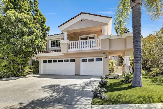 4064 Lemonberry Pl, Thousand Oaks, CA 91362 - view of front of property featuring a balcony, stucco siding, an attached garage, concrete driveway, and a tiled roof