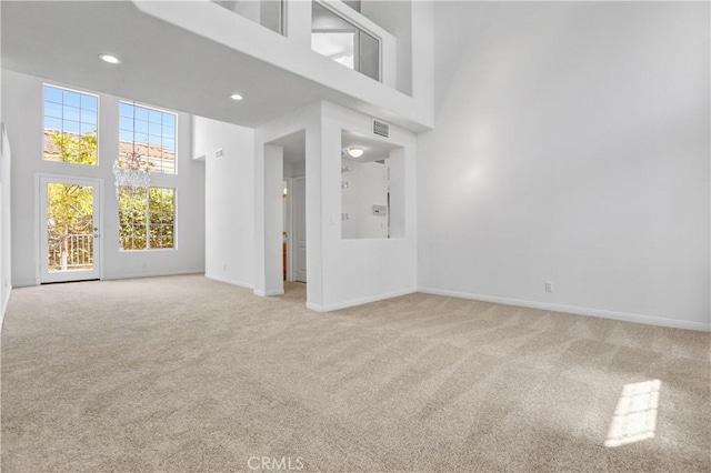 4064 Lemonberry Pl, Thousand Oaks, CA 91362 - unfurnished living room with carpet, a high ceiling, baseboards, a chandelier, and recessed lighting