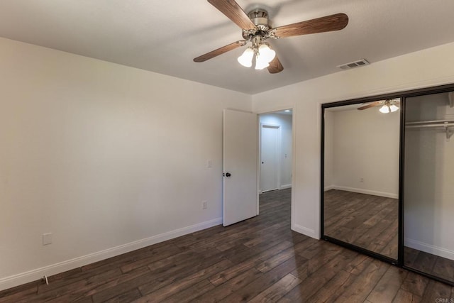 1279 Cypress Dr, Vista, CA 92084 - unfurnished bedroom featuring dark wood-style floors, a closet, and a ceiling fan