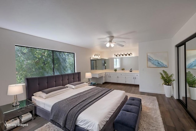 1279 Cypress Dr, Vista, CA 92084 - bedroom with dark wood-style floors and ensuite bathroom