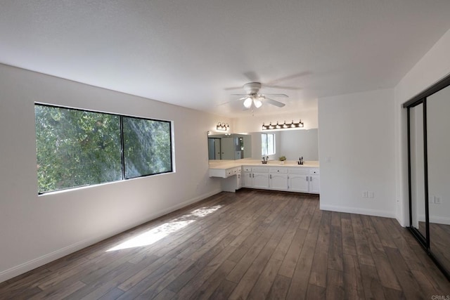 1279 Cypress Dr, Vista, CA 92084 - unfurnished living room with plenty of natural light, dark wood-style floors, and ceiling fan