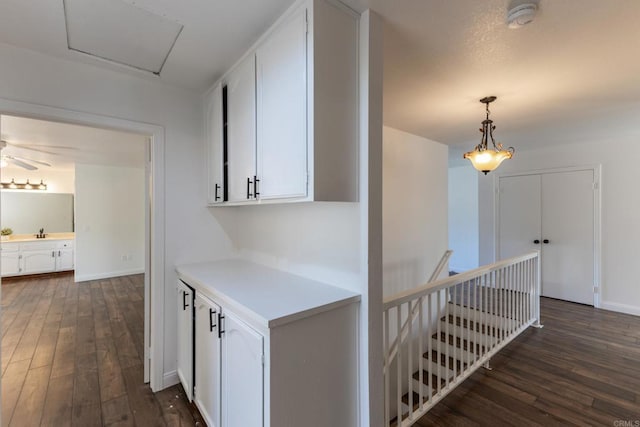 1279 Cypress Dr, Vista, CA 92084 - corridor featuring dark wood-type flooring and an upstairs landing