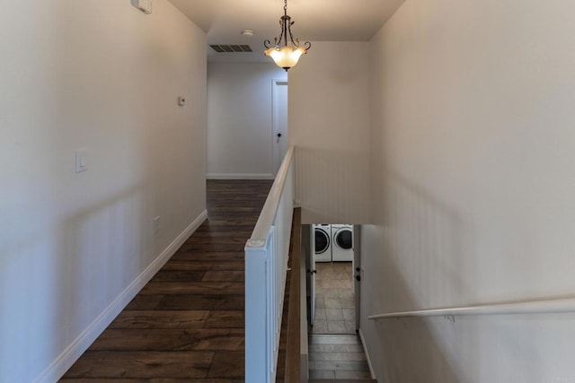 1279 Cypress Dr, Vista, CA 92084 - staircase featuring separate washer and dryer and wood finished floors
