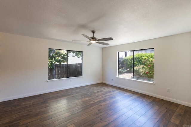 1279 Cypress Dr, Vista, CA 92084 - empty room with plenty of natural light, a ceiling fan, dark wood-type flooring, and a textured ceiling