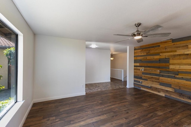 1279 Cypress Dr, Vista, CA 92084 - unfurnished room featuring hardwood / wood-style flooring, a ceiling fan, and wood walls