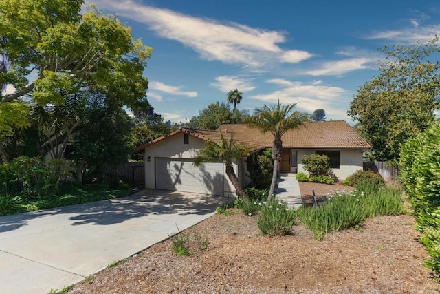 1279 Cypress Dr, Vista, CA 92084 - view of front facade featuring a tiled roof, stucco siding, concrete driveway, and a garage