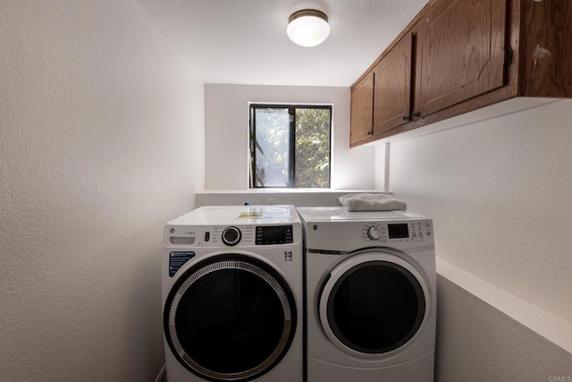 1279 Cypress Dr, Vista, CA 92084 - laundry area with washing machine and dryer, cabinet space, and a textured wall