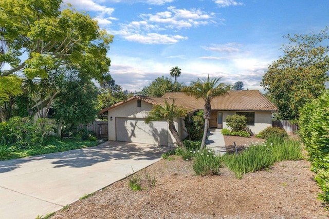1279 Cypress Dr, Vista, CA 92084 - view of front of house with a tiled roof, stucco siding, concrete driveway, and an attached garage