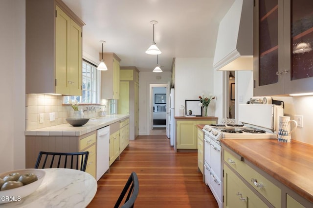 1770 Loma Vista St, Pasadena, CA 91104 - kitchen with white appliances, light countertops, dark wood finished floors, tasteful backsplash, and hanging light fixtures