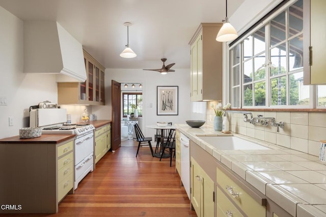 1770 Loma Vista St, Pasadena, CA 91104 - kitchen with white appliances, a sink, wood finished floors, backsplash, and glass insert cabinets