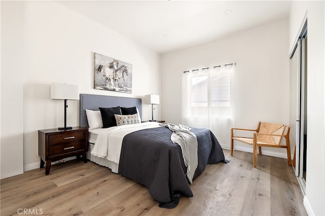 1251 Leighton Ave Unit 1251, Los Angeles, CA 90037 - bedroom featuring light wood-style flooring and baseboards