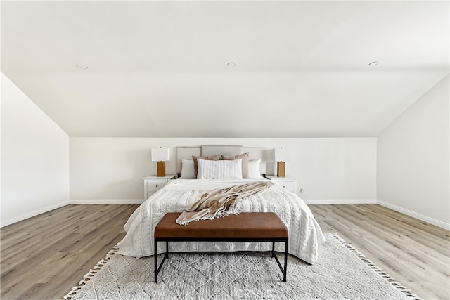 1251 Leighton Ave Unit 1251, Los Angeles, CA 90037 - bedroom with light wood-type flooring, vaulted ceiling, and baseboards