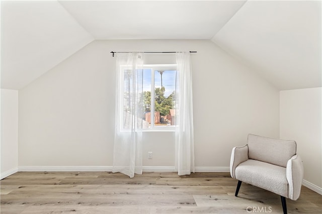 1251 Leighton Ave Unit 1251, Los Angeles, CA 90037 - living area with vaulted ceiling, light wood-style floors, and baseboards