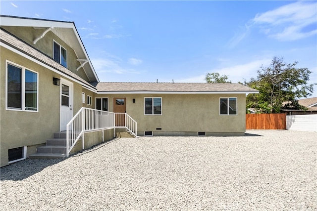 1251 Leighton Ave Unit 1251, Los Angeles, CA 90037 - back of property with crawl space and stucco siding