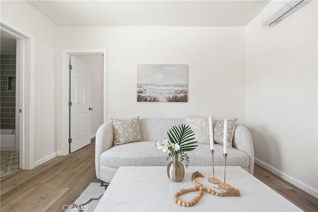 1251 Leighton Ave Unit 1251, Los Angeles, CA 90037 - living area with a wall unit AC, wood finished floors, and baseboards