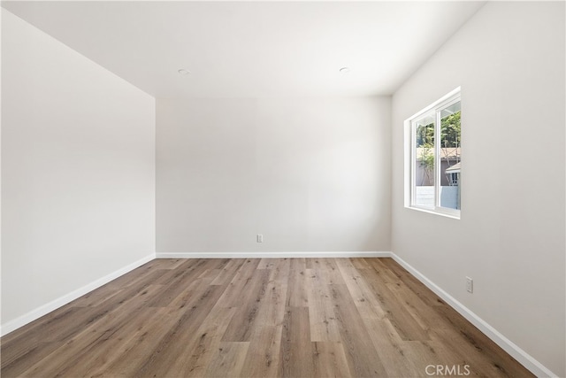 1251 Leighton Ave Unit 1251, Los Angeles, CA 90037 - spare room featuring light wood-type flooring and baseboards