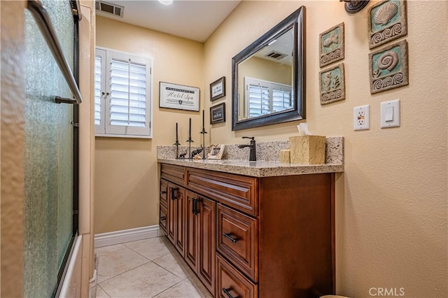 30525 Greenbrook Pl, Canyon Lake, CA 92587 - full bath featuring a shower with door, tile patterned flooring, vanity, and baseboards