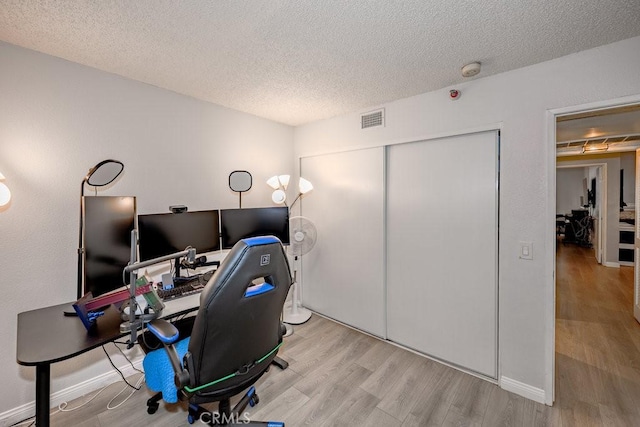 6545 Reseda Blvd Unit 3, Reseda, CA 91335 - office area featuring wood finished floors and a textured ceiling