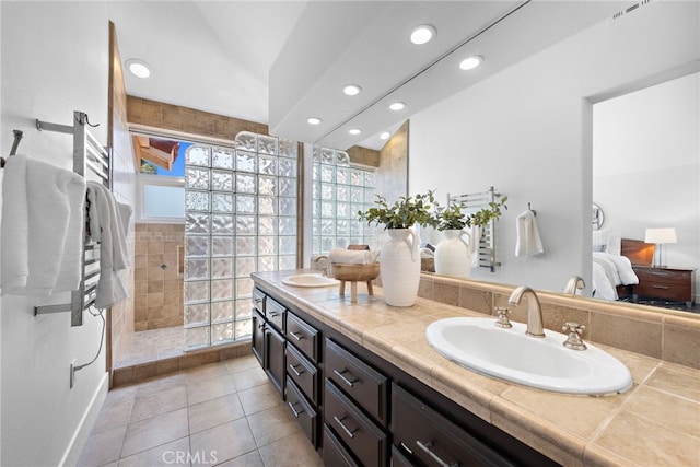 34550 Calle Naranja, Dana Point, CA 92624 - full bathroom with double vanity, walk in shower, recessed lighting, a towel warming rack, and tile patterned flooring