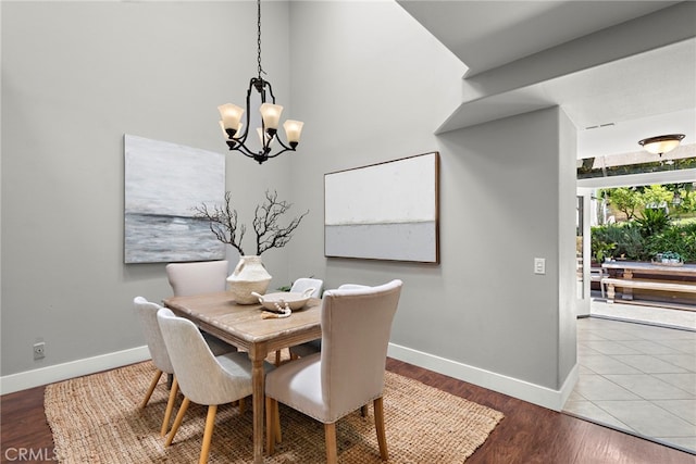 34550 Calle Naranja, Dana Point, CA 92624 - dining area featuring a chandelier, baseboards, and wood finished floors