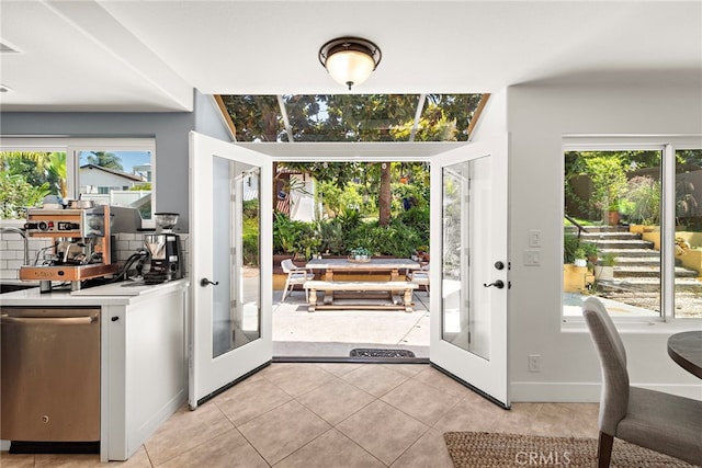 34550 Calle Naranja, Dana Point, CA 92624 - doorway to outside featuring french doors, healthy amount of natural light, light tile patterned floors, and baseboards