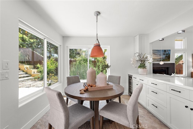 34550 Calle Naranja, Dana Point, CA 92624 - dining space with light tile patterned flooring, beverage cooler, and baseboards