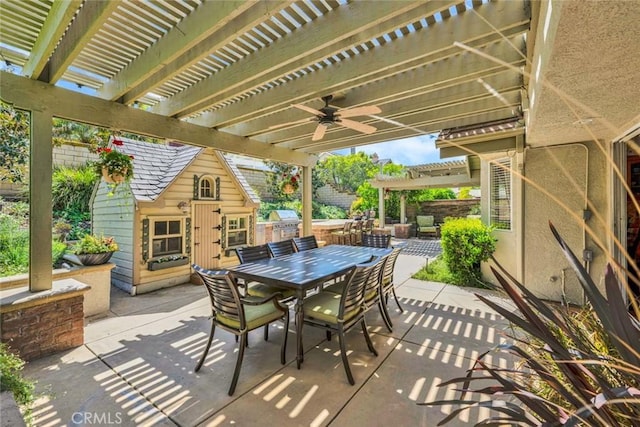 view of patio with a pergola, outdoor dining area, and a ceiling fan
