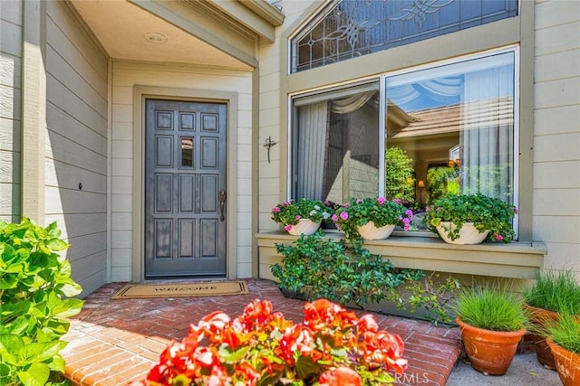 doorway to property featuring a porch