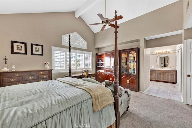 bedroom with carpet flooring, high vaulted ceiling, beam ceiling, ensuite bathroom, and ceiling fan