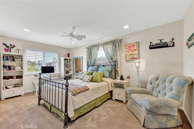 bedroom featuring multiple windows, light colored carpet, recessed lighting, and ceiling fan