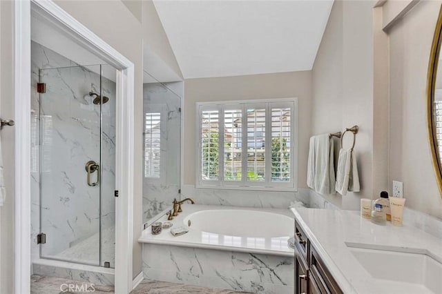 full bathroom with a marble finish shower, a garden tub, marble finish floors, vanity, and lofted ceiling