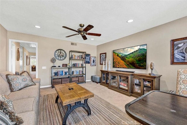 living room with carpet floors, a ceiling fan, recessed lighting, and baseboards