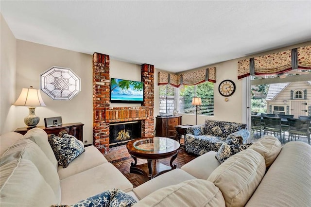 living room featuring a fireplace and wood finished floors