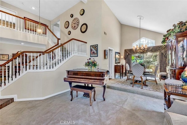 living area with a chandelier, high vaulted ceiling, carpet flooring, stairway, and baseboards