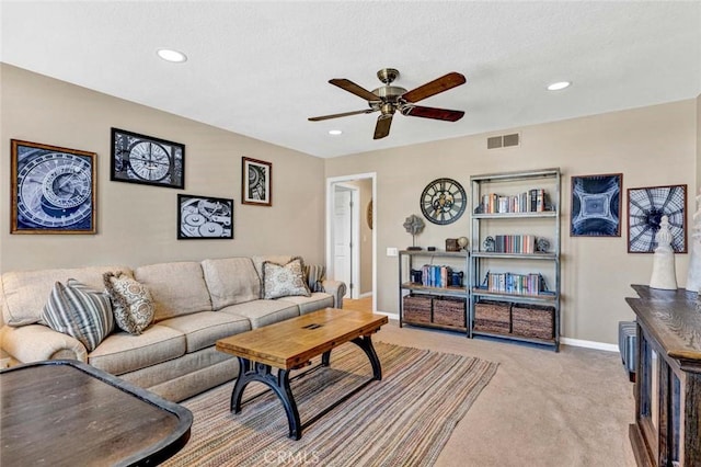 carpeted living area featuring ceiling fan, recessed lighting, and baseboards