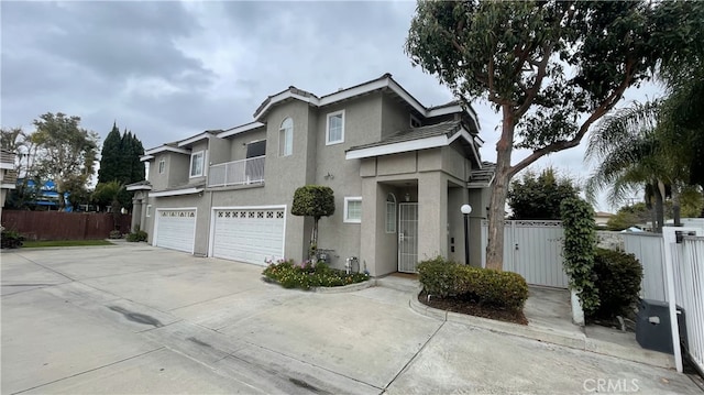 13442 Flower St Unit 15, Garden Grove, CA 92843 - traditional-style home with stucco siding, an attached garage, and concrete driveway