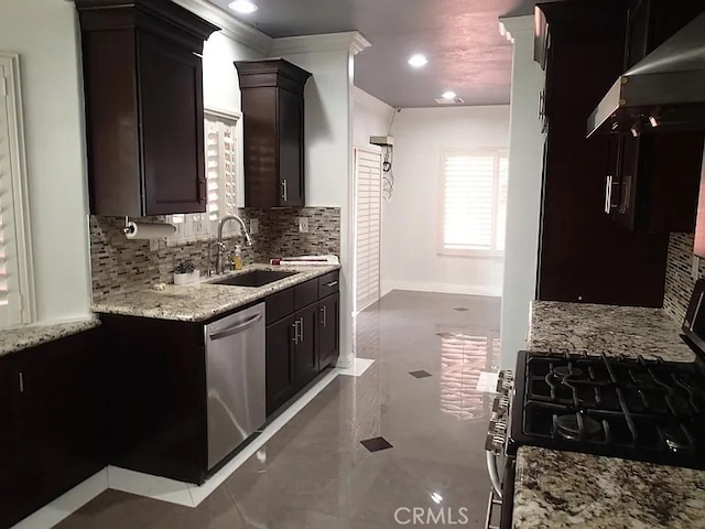 13442 Flower St Unit 15, Garden Grove, CA 92843 - kitchen with under cabinet range hood, stainless steel appliances, plenty of natural light, tasteful backsplash, and recessed lighting