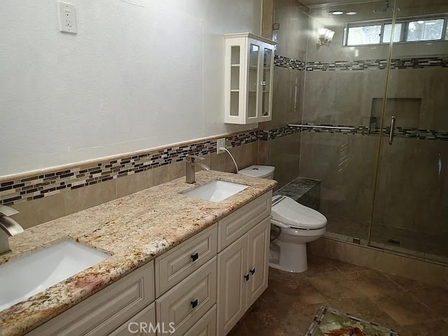 13442 Flower St Unit 15, Garden Grove, CA 92843 - full bath with double vanity, a stall shower, tile walls, and decorative backsplash