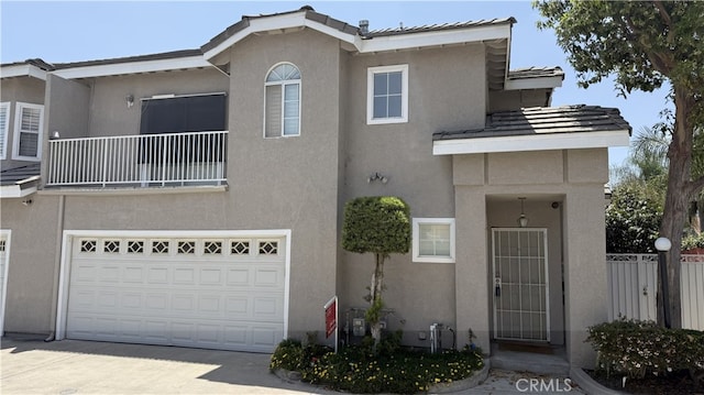 13442 Flower St Unit 15, Garden Grove, CA 92843 - view of front of house with stucco siding, driveway, and an attached garage