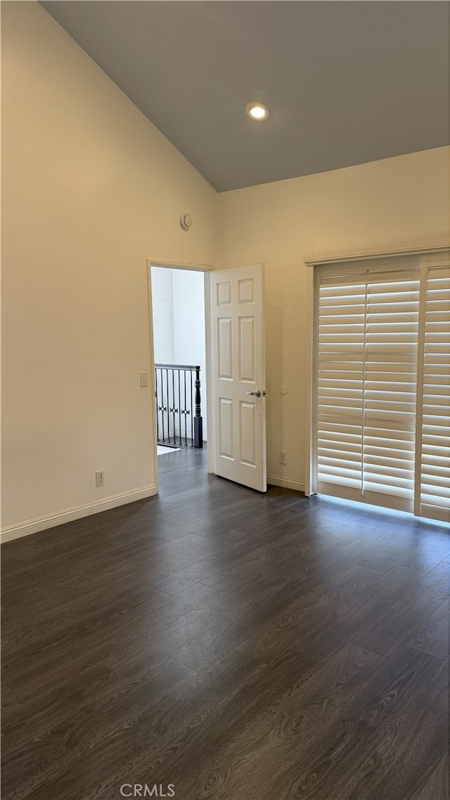 13442 Flower St Unit 15, Garden Grove, CA 92843 - empty room featuring dark wood-style floors, high vaulted ceiling, and recessed lighting