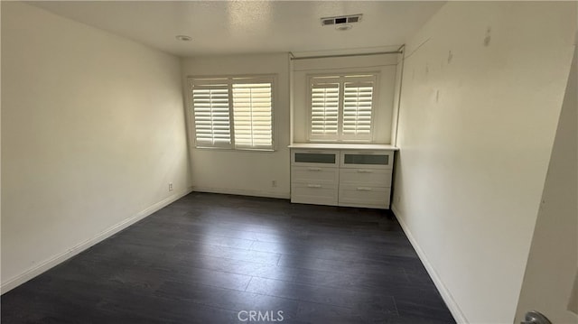 13442 Flower St Unit 15, Garden Grove, CA 92843 - unfurnished room with dark wood-style flooring and baseboards