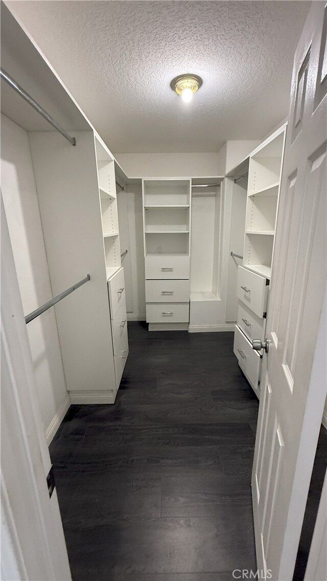 13442 Flower St Unit 15, Garden Grove, CA 92843 - spacious closet with dark wood finished floors and washer / clothes dryer